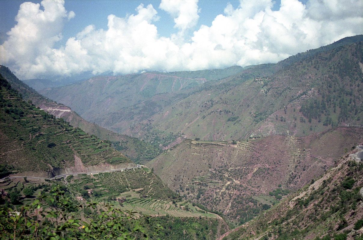 15 Verdant Steep Sided Valley From Paved Road After Kaghan We drove over a very good dirt road from Naran to Kaghan.  We followed the Kunhar River through the verdent steep sided valley. Just past Kaghan, the very good newly paved road begins, interspersed with frequent dirt patches.